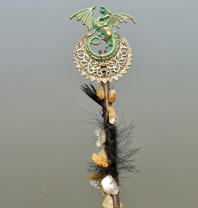 Decorative Amethyst Witch Crystal Wand with metallic dragon and crystal adornments.