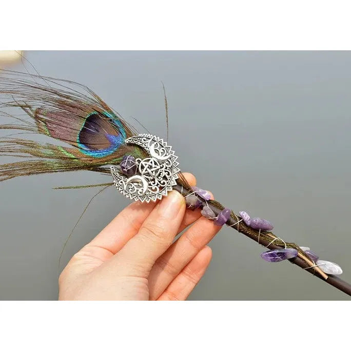 Decorative Amethyst Witch Crystal Wand with peacock feather, crystals, and silver metalwork.